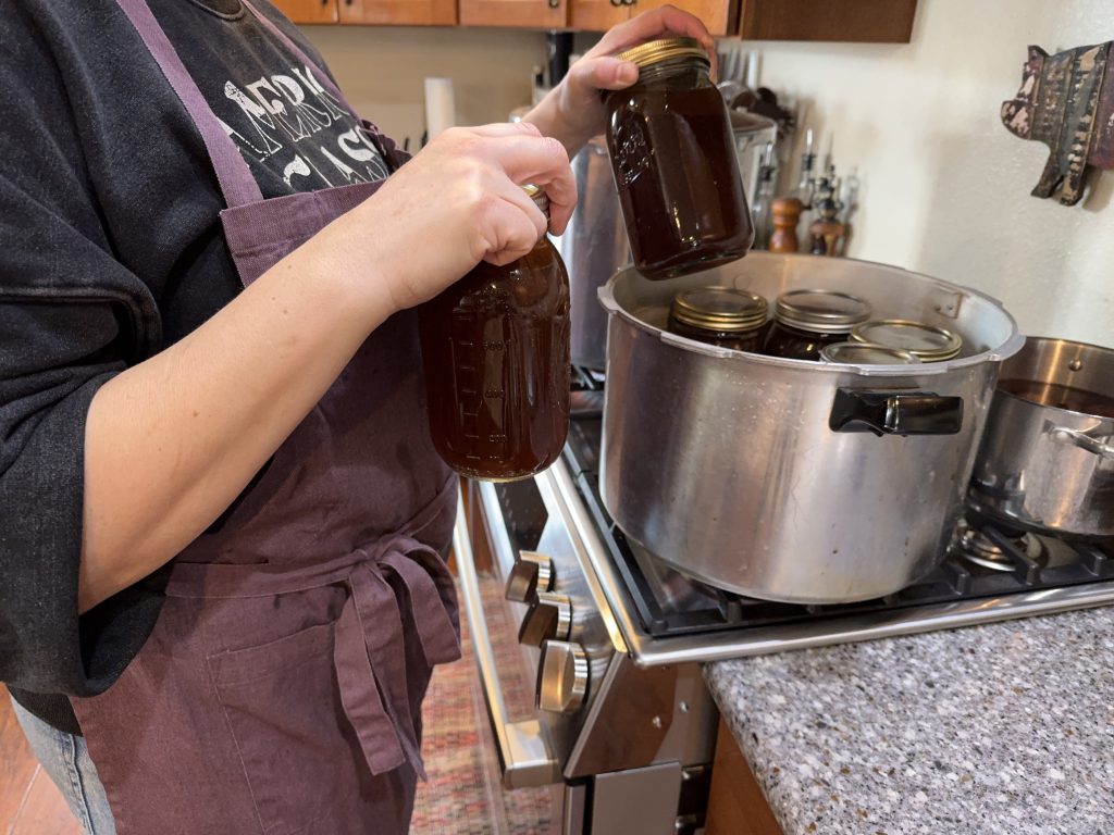 Beef broth going into the pressure canner, a great way to use leftover beef bones and scrap meat.