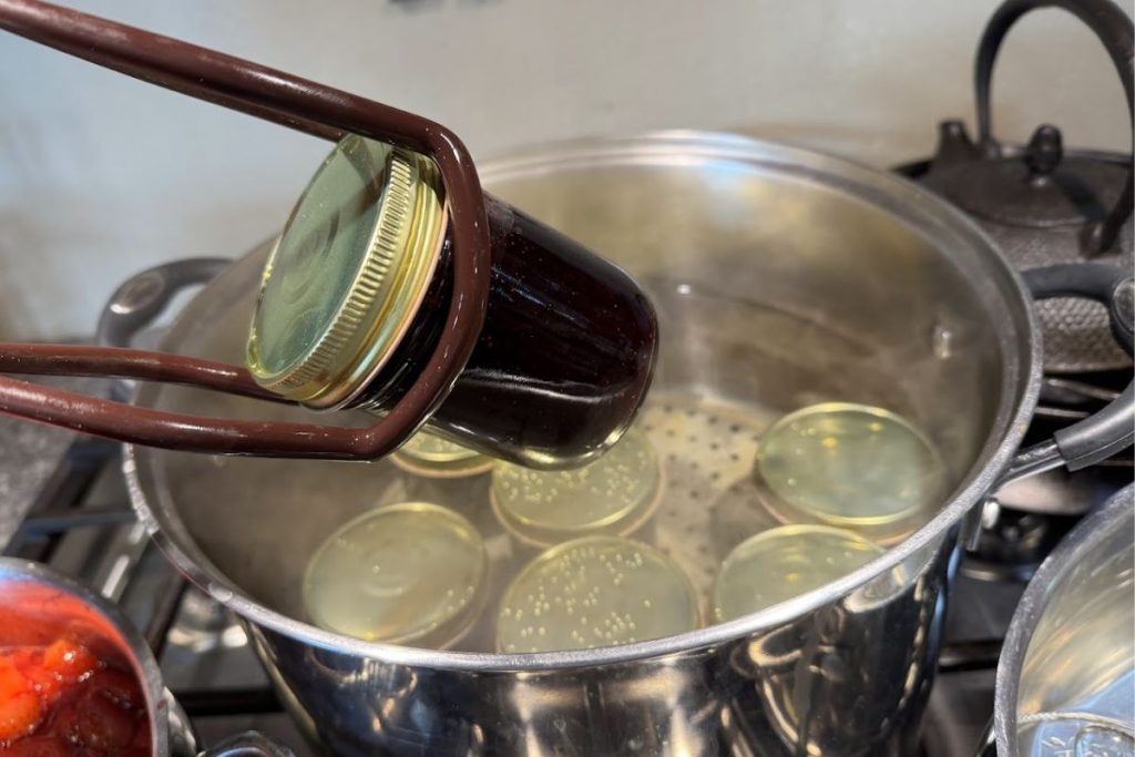 Removing hot jars from the water bath canner.